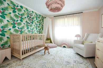 Trendy gray floor and wallpaper nursery photo in Los Angeles with multicolored walls