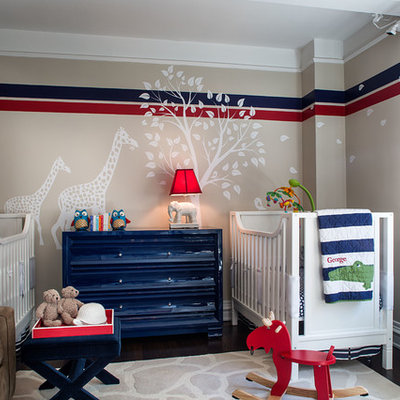 Example of a transitional boy dark wood floor nursery design in New York with beige walls