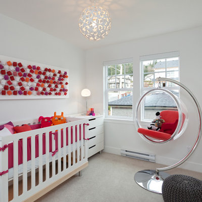 Nursery - small contemporary gender-neutral carpeted nursery idea in Vancouver with white walls