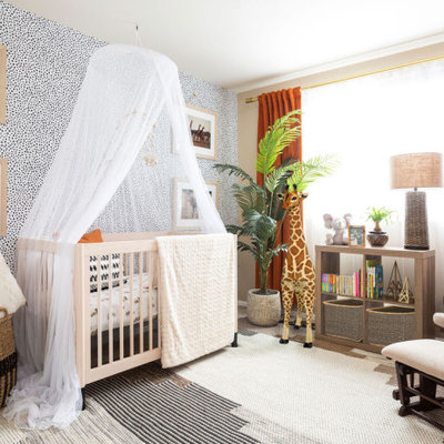 Example of a small trendy gender-neutral carpeted, multicolored floor and wallpaper nursery design in Denver with multicolored walls
