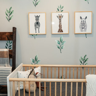 Inspiration for a mid-sized farmhouse gender-neutral medium tone wood floor and brown floor nursery remodel in New York with gray walls