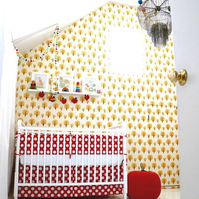 Inspiration for a mid-sized scandinavian girl painted wood floor nursery remodel in Las Vegas with white walls