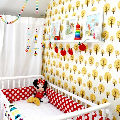 Inspiration for a mid-sized scandinavian girl painted wood floor nursery remodel in Las Vegas with white walls