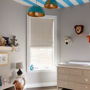 Inspiration for a mid-sized transitional gender-neutral dark wood floor and brown floor nursery remodel in Chicago with gray walls