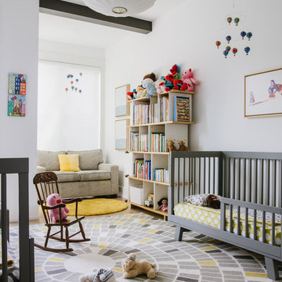 Mid-sized trendy gender-neutral carpeted and multicolored floor nursery photo in DC Metro with white walls