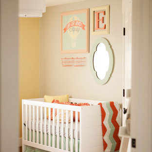 Inspiration for a mid-sized eclectic girl carpeted nursery remodel in Salt Lake City with beige walls