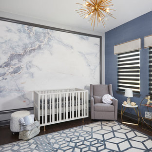 Mid-sized transitional boy light wood floor nursery photo in Austin with blue walls