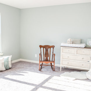 Example of a small cottage gender-neutral carpeted nursery design in Louisville with green walls