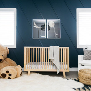 Mid-sized transitional boy carpeted and gray floor nursery photo in Orange County with blue walls