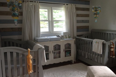 Inspiration for a medium sized farmhouse gender neutral nursery in Chicago with white walls, medium hardwood flooring and brown floors.