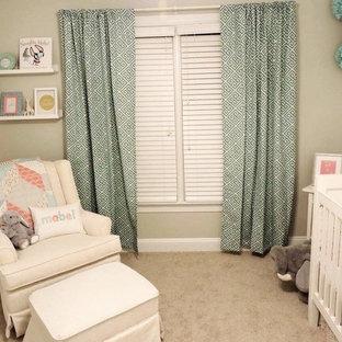 Example of a small classic girl carpeted nursery design in Raleigh with gray walls