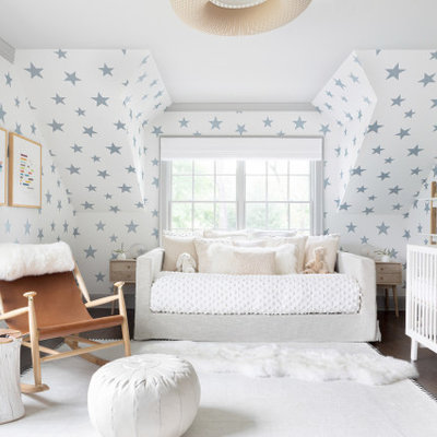 Nursery - large contemporary gender-neutral dark wood floor and brown floor nursery idea in New York with multicolored walls
