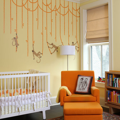 Example of a transitional gender-neutral dark wood floor nursery design in Chicago with multicolored walls
