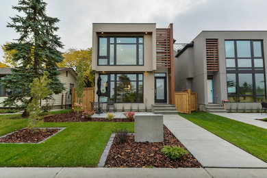 Mid-sized minimalist front yard stone patio photo in Edmonton