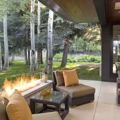 Example of a trendy patio design in Denver with a fire pit