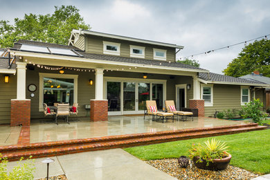 Patio - large traditional backyard concrete patio idea in Sacramento with a fire pit and a pergola