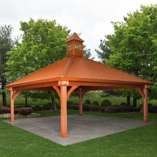 Patio kitchen - large transitional backyard stone patio kitchen idea in Boston with a gazebo