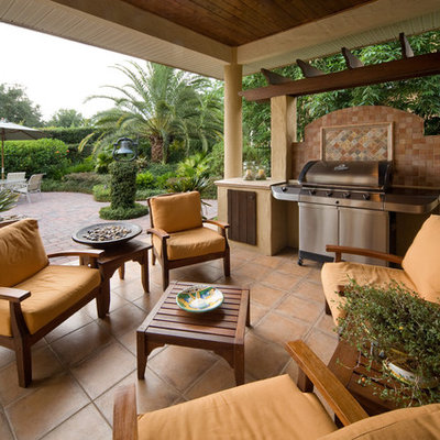 Example of a trendy patio design in Orlando with a pergola