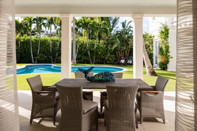 Example of a beach style patio design in Miami