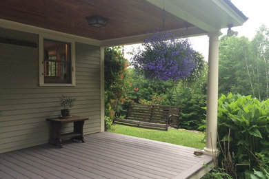 Inspiration for a large transitional backyard patio remodel in Burlington with a roof extension