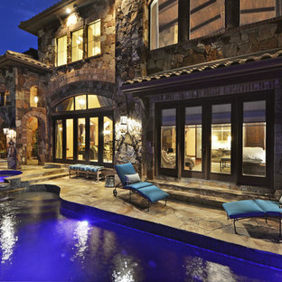 Inspiration for a mediterranean front yard stone patio fountain remodel in Austin with no cover