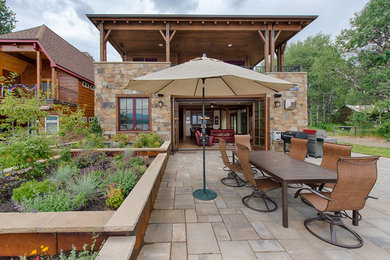 Patio - rustic backyard patio idea in Boise with no cover