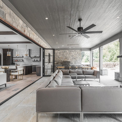 Trendy backyard patio photo in Indianapolis with a roof extension and a fireplace