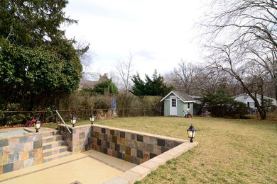 Example of a mid-sized arts and crafts backyard tile patio design in Other with no cover