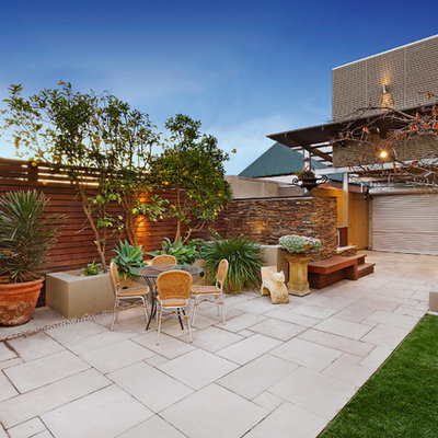 Inspiration for a mid-sized contemporary patio remodel in Melbourne with no cover