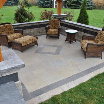 A Backyard Patio With a Spacious Feel and an Amazing Fireplace!