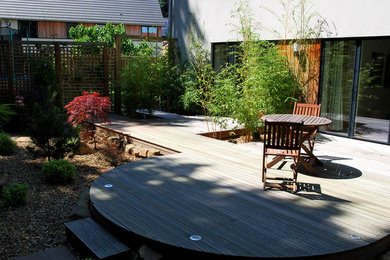 Design ideas for a medium sized contemporary back patio in Other with decking.