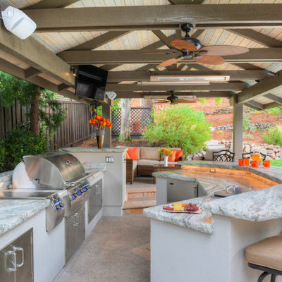 Example of a large transitional backyard patio kitchen design in San Francisco with a gazebo