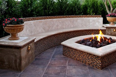 Inspiration for a contemporary back patio in Los Angeles with a fire feature, tiled flooring and no cover.