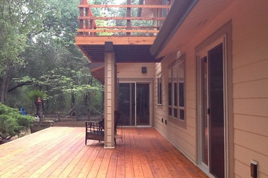 Patio - large rustic backyard patio idea in Sacramento with decking and a roof extension