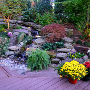 Alexandria Sloped Yard - Raised Patio, Fire Pit, & Water Feature