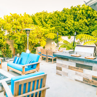Example of a mid-sized trendy backyard concrete patio kitchen design in Orange County