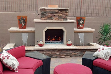 Large elegant backyard patio photo in Phoenix with a fire pit