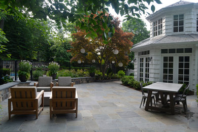 Example of a transitional patio design in New York