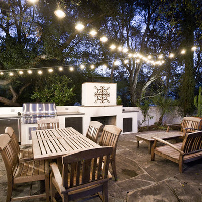 Patio - mid-sized contemporary backyard stone patio idea in Los Angeles with no cover