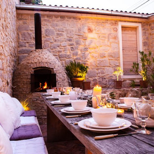 Esempio di un patio o portico mediterraneo