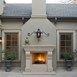 Inspiration for a mediterranean courtyard patio remodel in Dallas with a fire pit