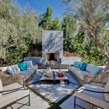 An Outdoor Living Room, Fireplace Defined by Mature Olives