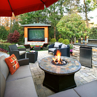 Inspiration for a contemporary backyard brick patio remodel in Detroit
