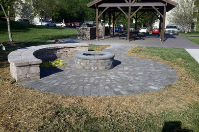 Photo of a large traditional patio in Raleigh with natural stone paving.