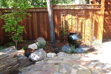 Small tuscan courtyard stone patio fountain photo in San Francisco with no cover