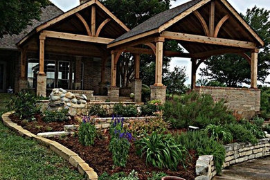 Inspiration for a large timeless backyard patio remodel in Dallas with a gazebo