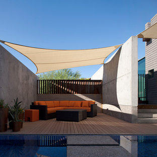 Patio - mid-sized contemporary backyard patio idea in Phoenix with decking and an awning