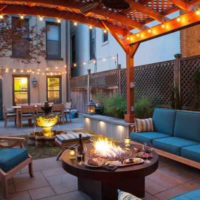 Transitional backyard patio photo in San Francisco with a fire pit and a gazebo