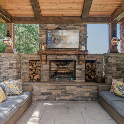Mountain style patio photo in Nashville with a roof extension and a fireplace