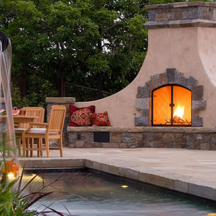 Tuscan patio photo in San Francisco with a fire pit